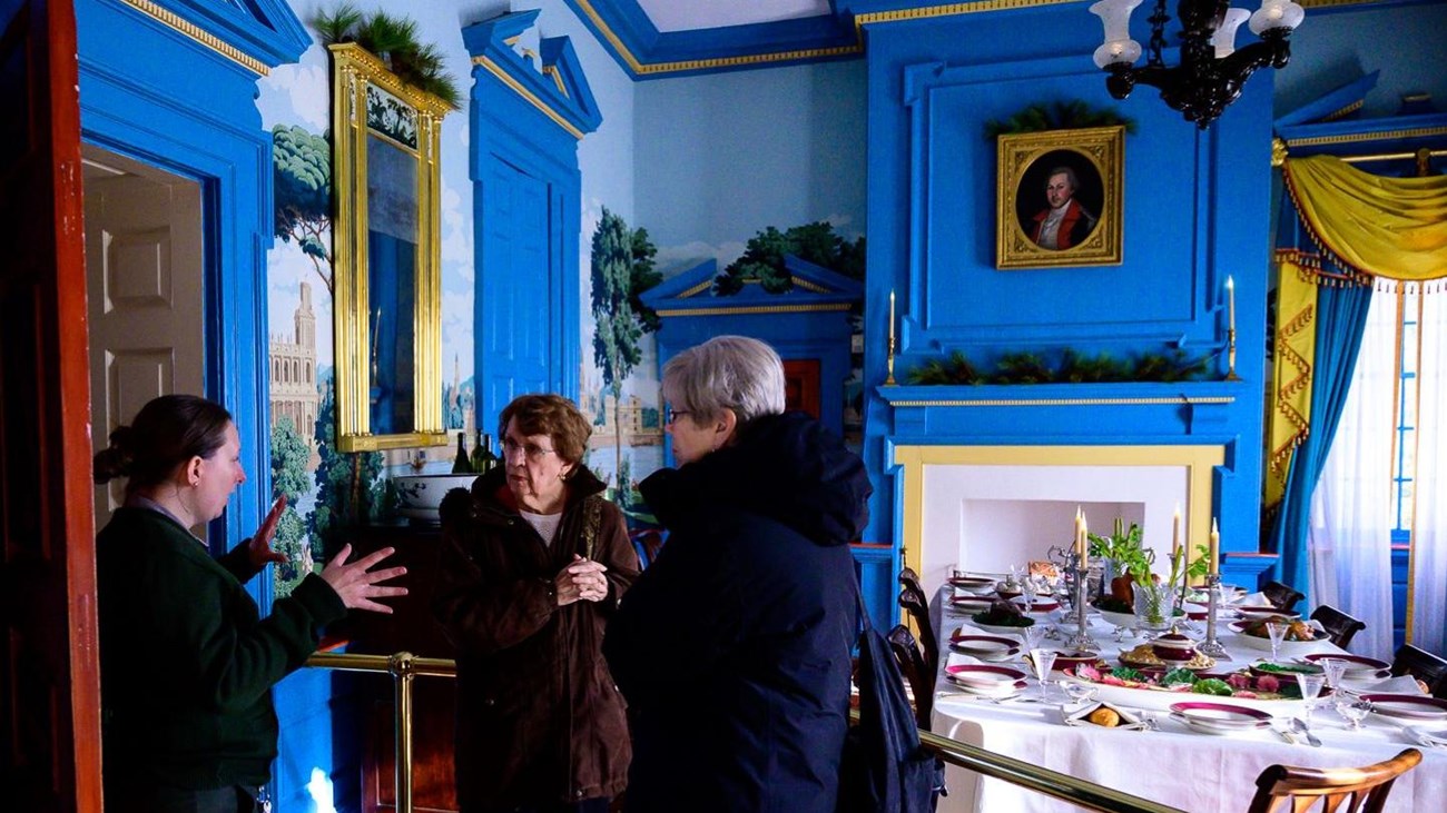A park ranger gives a tour of the dining room inside the Hampton mansion.