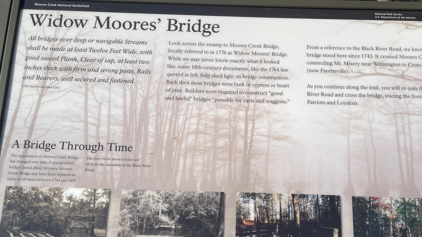 Metal sign focused on Widow Moores\' Bridge