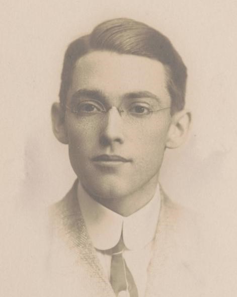 A portrait of a young man wearing glasses