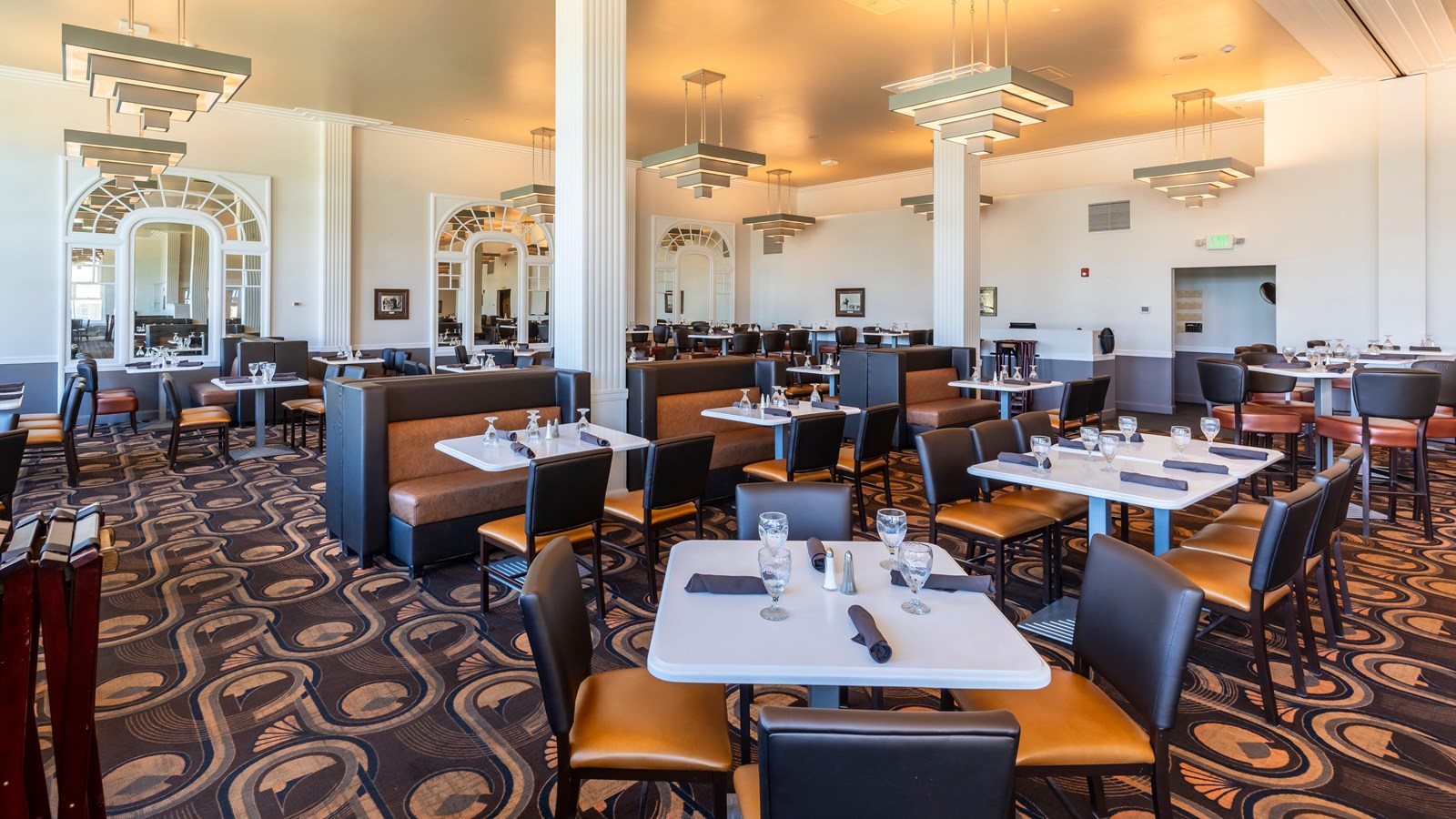An elegant dining room with white columns