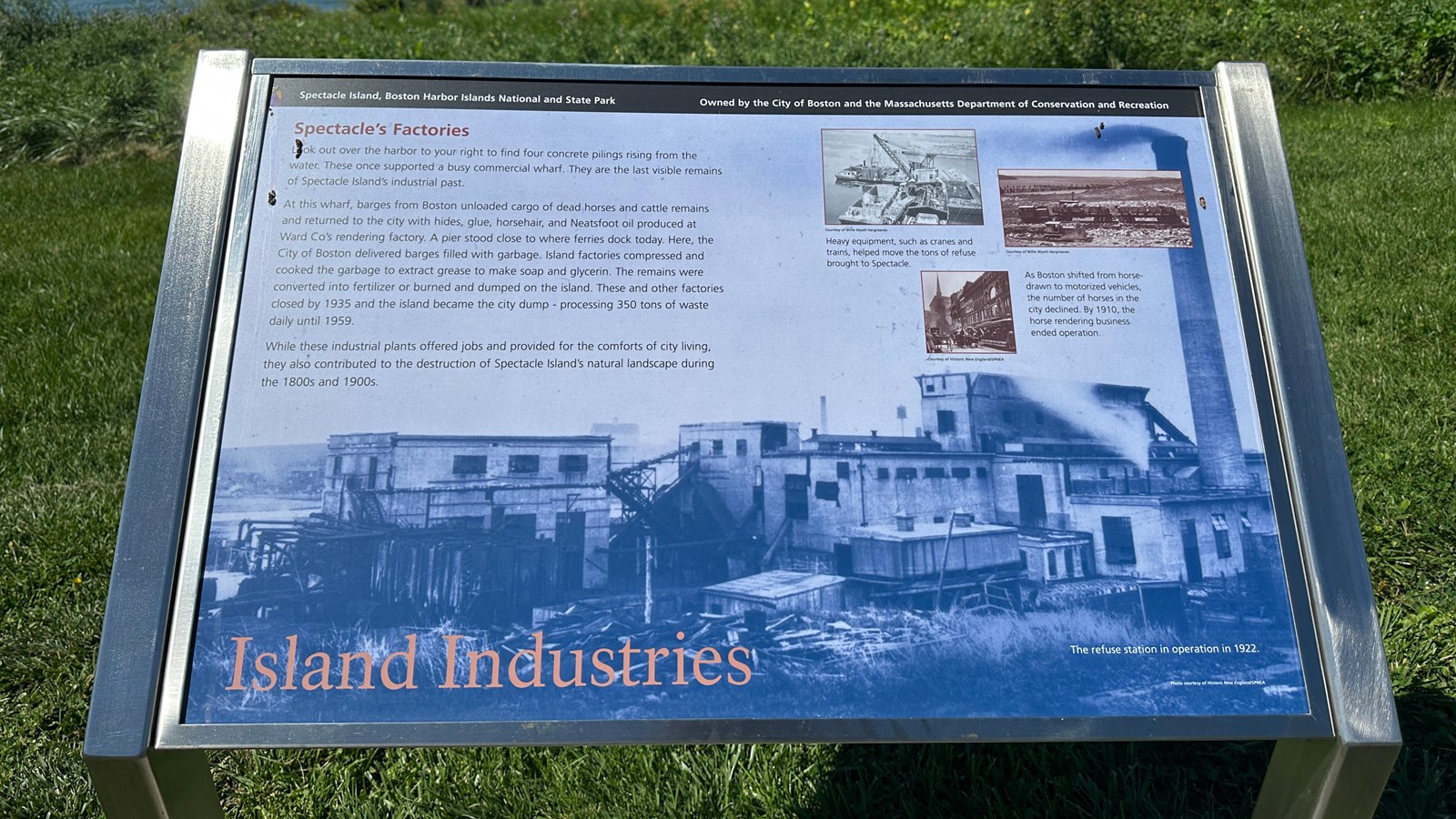 Photo of a metal wayside with a black and white photo with a column of text