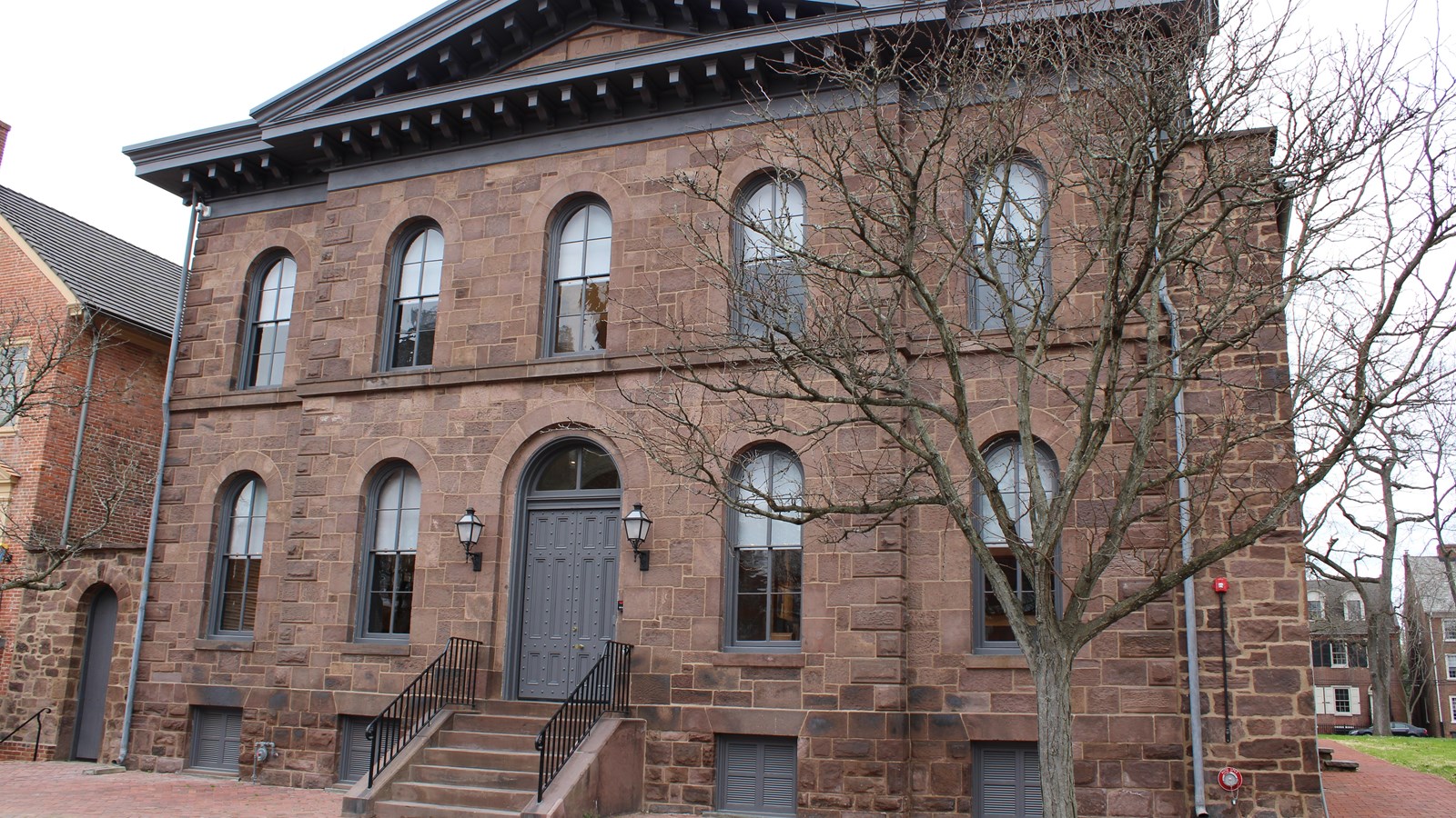 A brown two-story building.
