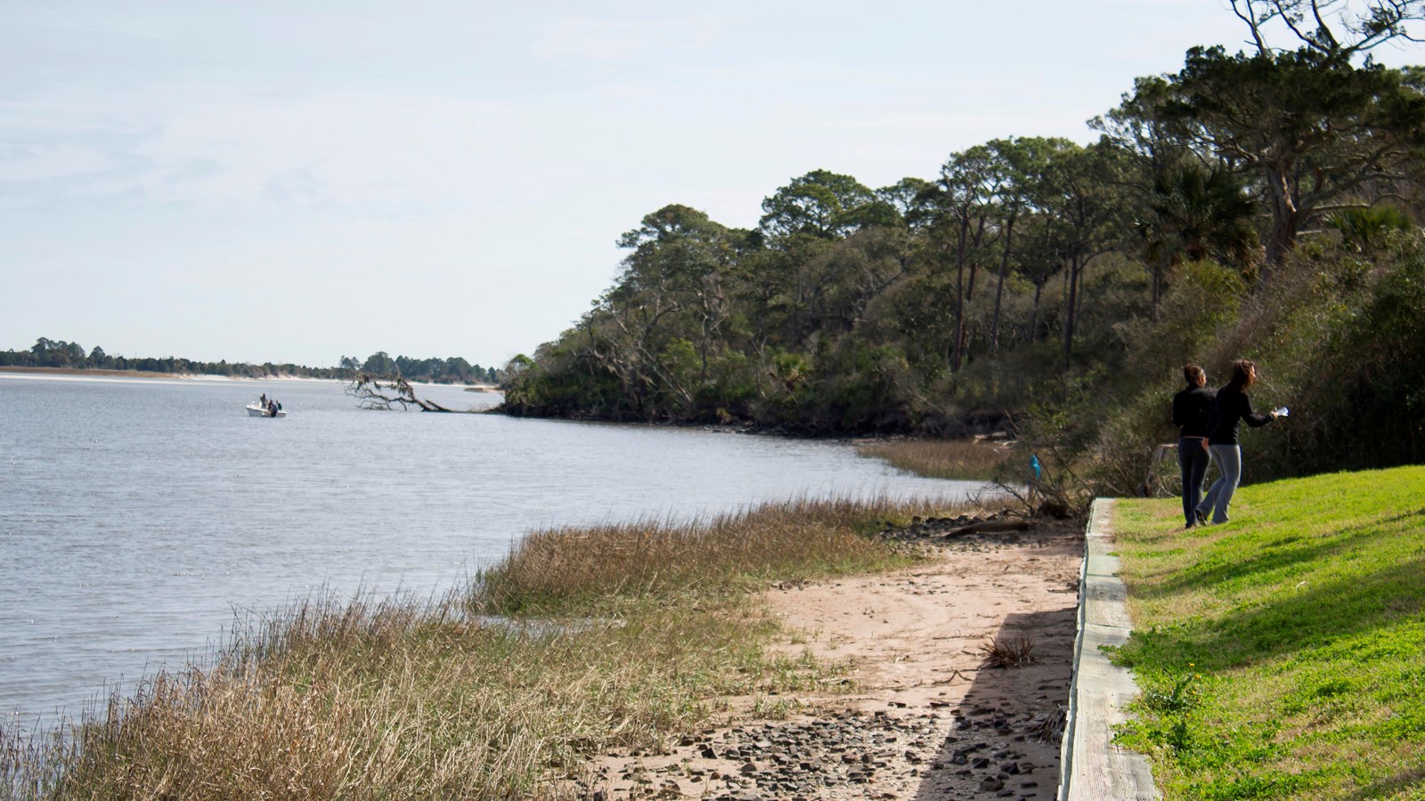 sea wall along river with marsh