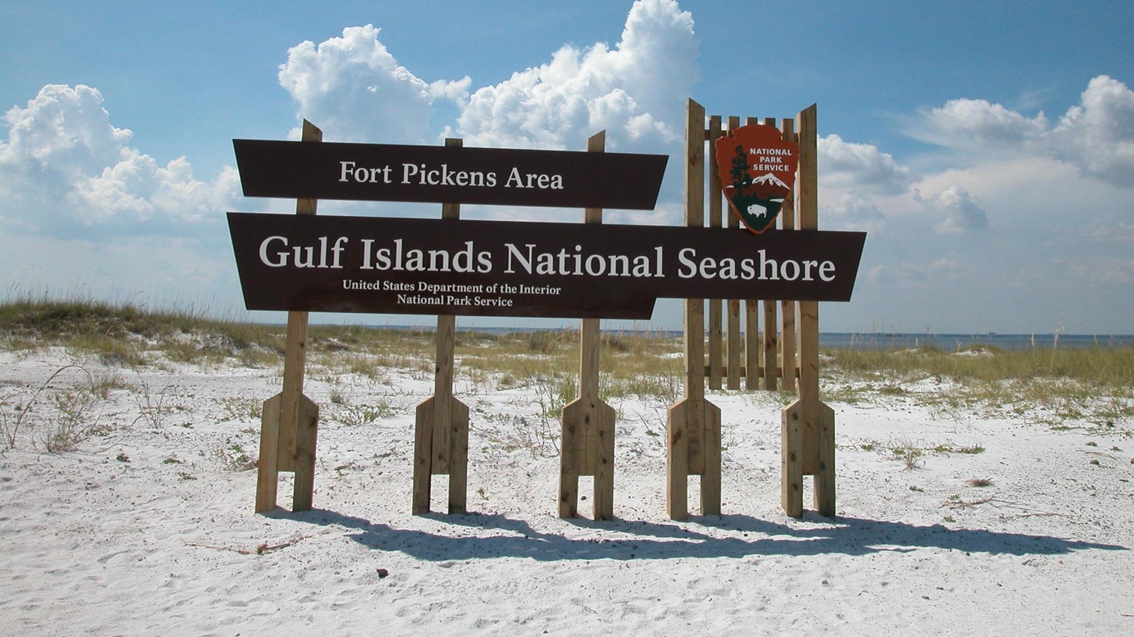 Brown sign white sand