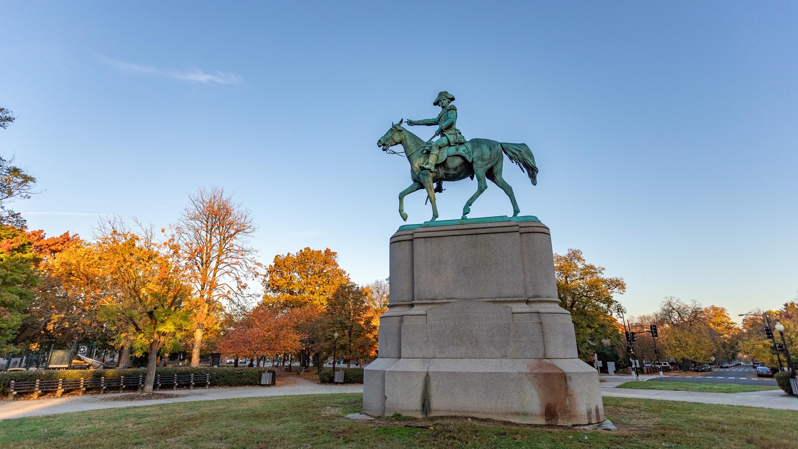 A statue of Nathanael Greene riding a horse. He is pointing his out in the distance