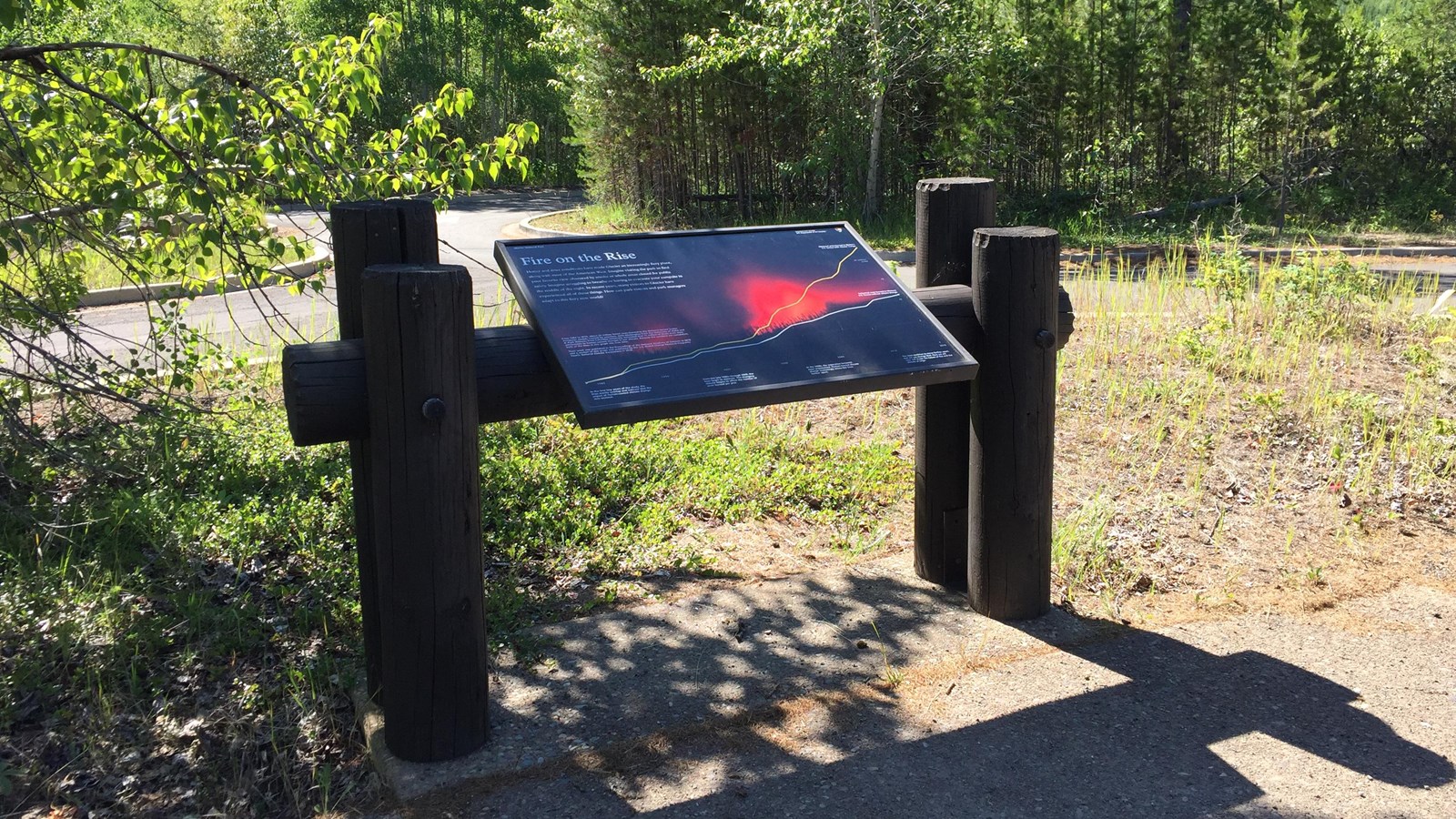 A panel with a photo of fire at night shows the increase of fires due to climate change.