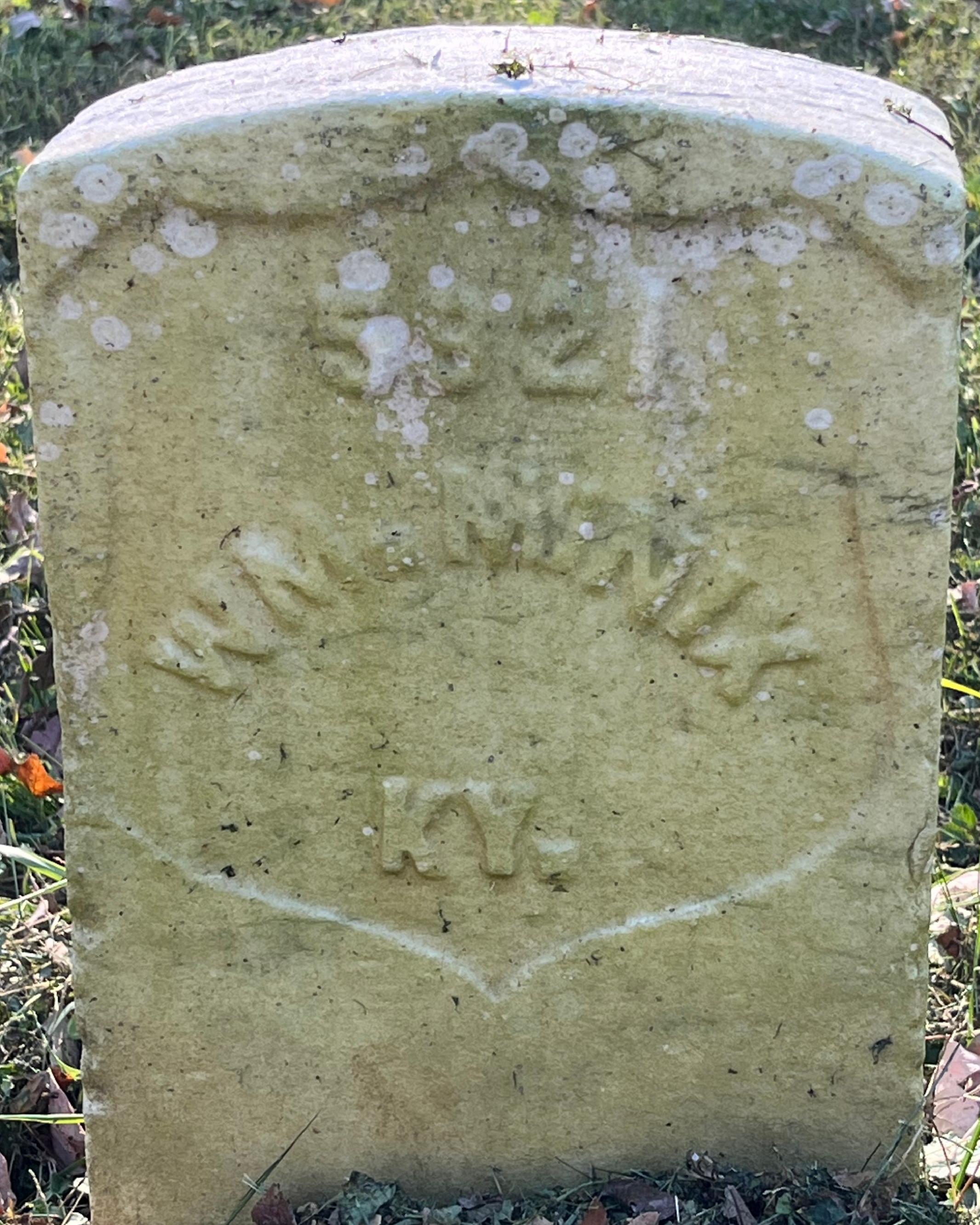 White marble headstone reading, "5921 Wm. Minix KY."