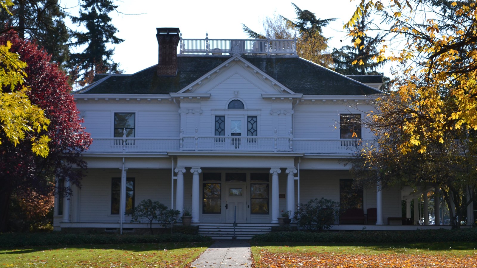 Large, grand white house.