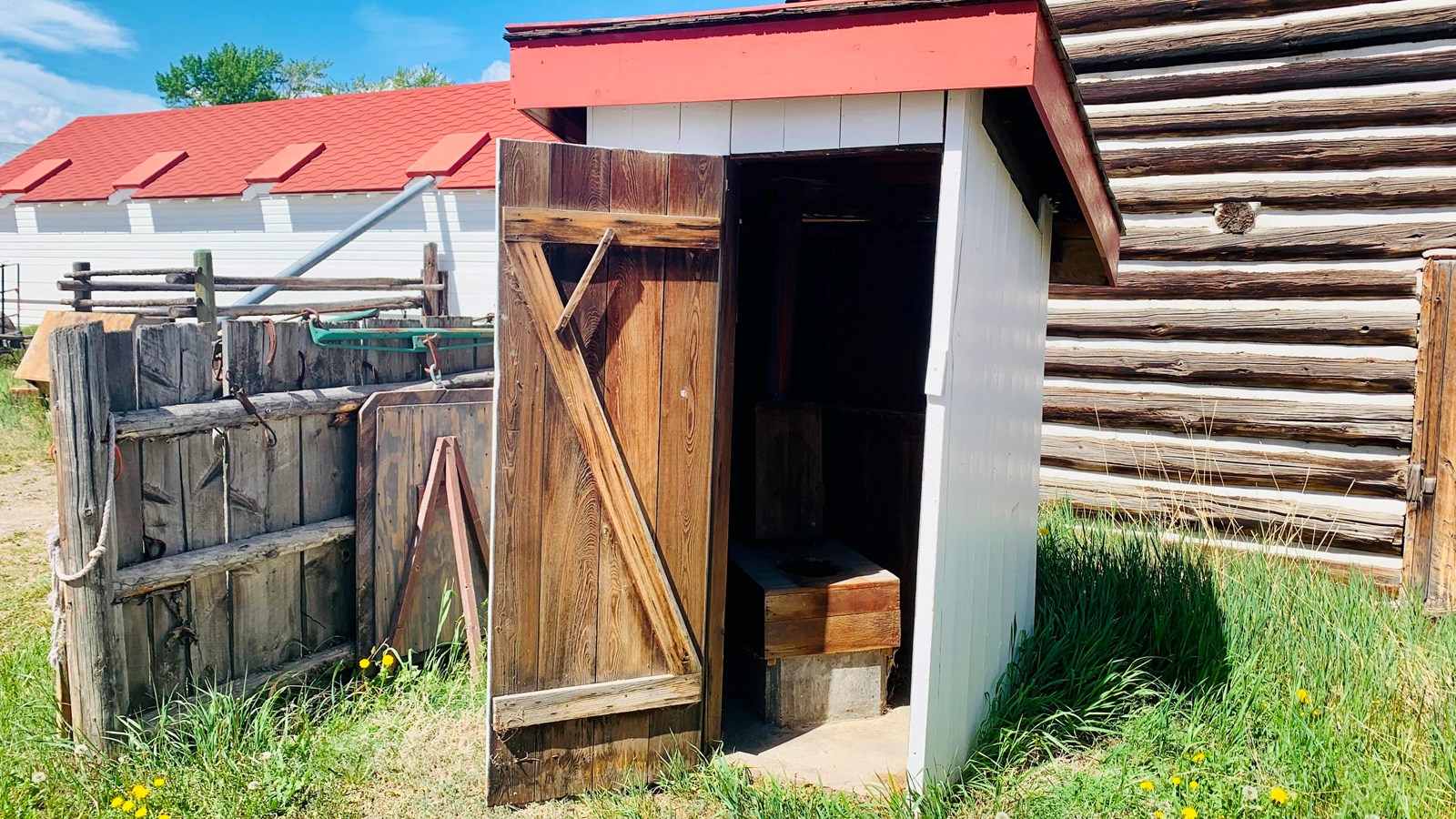 This red and white outhouse was constructed in the 1930\'s by the Works Project Administration. 