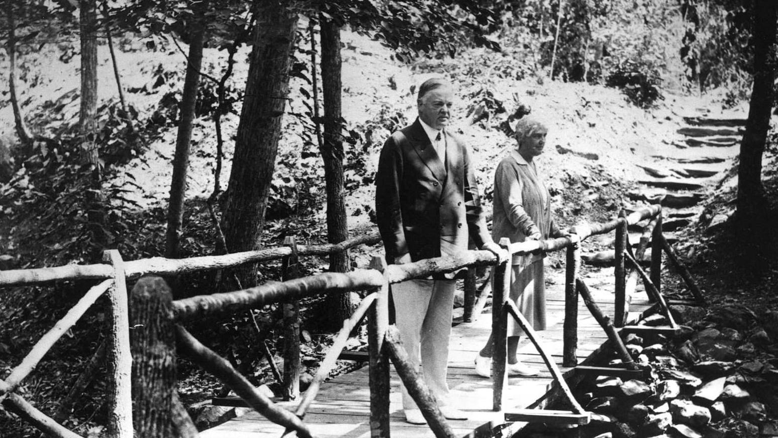 Black and white historic photo of the Hoovers standing on the bridge.