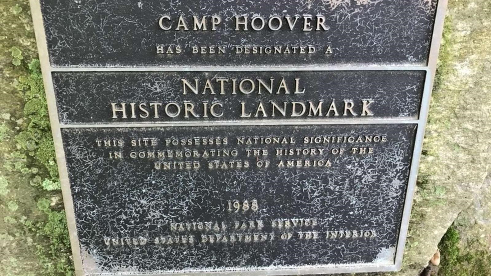 A bronze plaque on a rock commemorating the site.