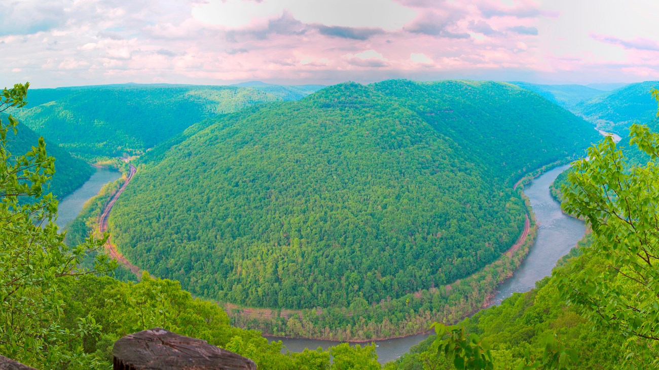 Colored photo looking down into the gorge at a bend in the New River