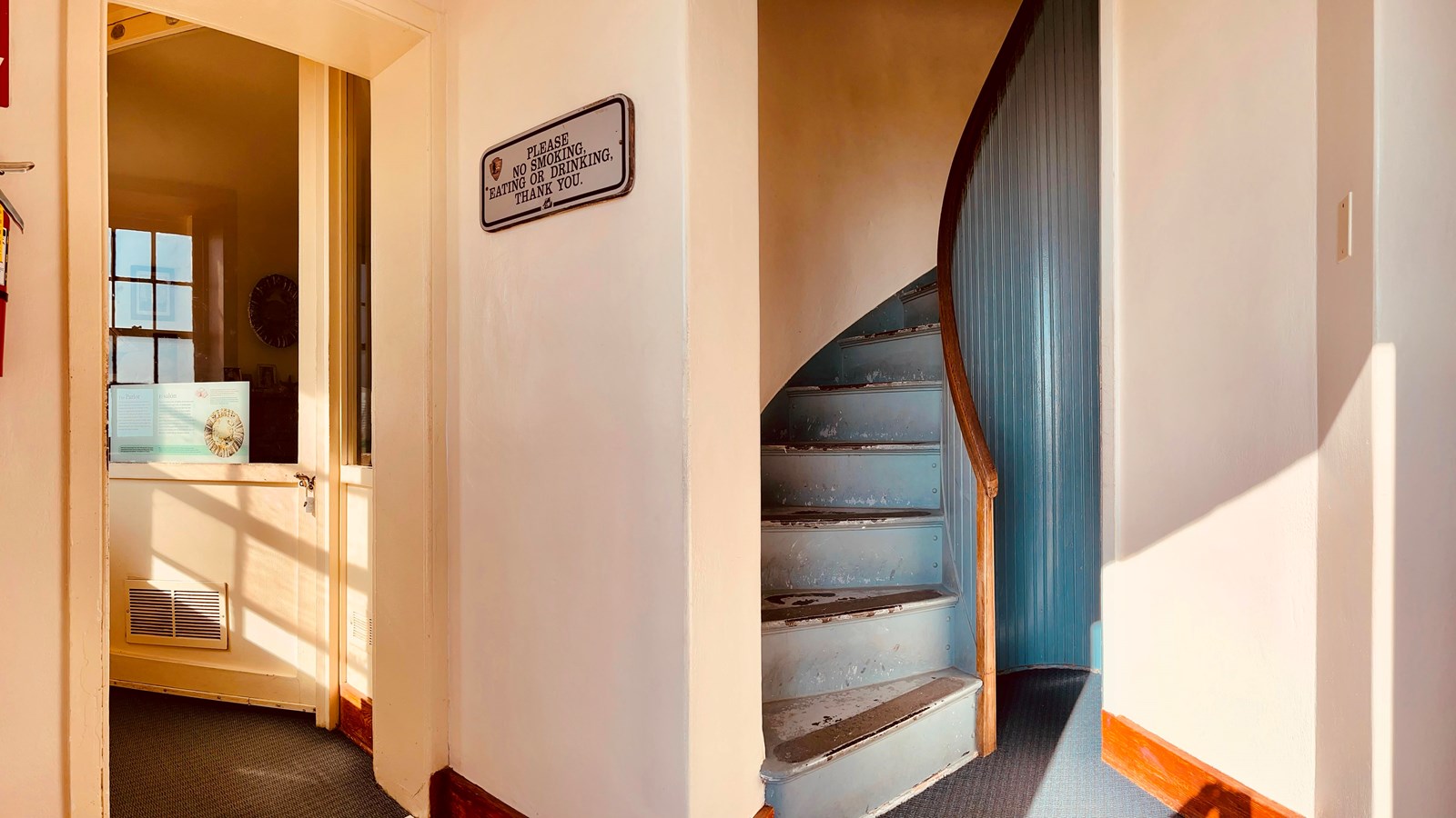 White walls and a spiral staircase.