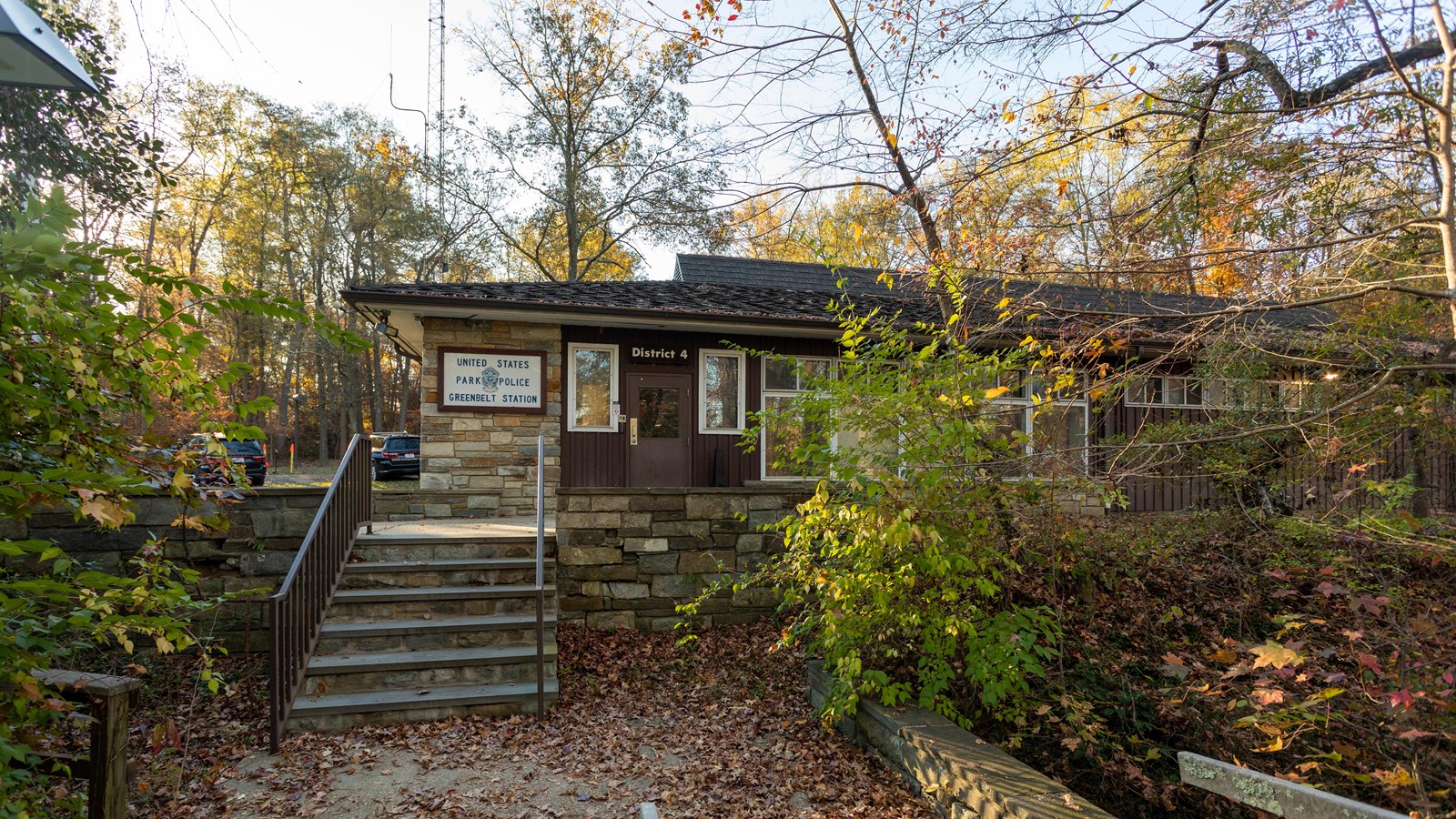 A police headquarters building surrounded by woods.