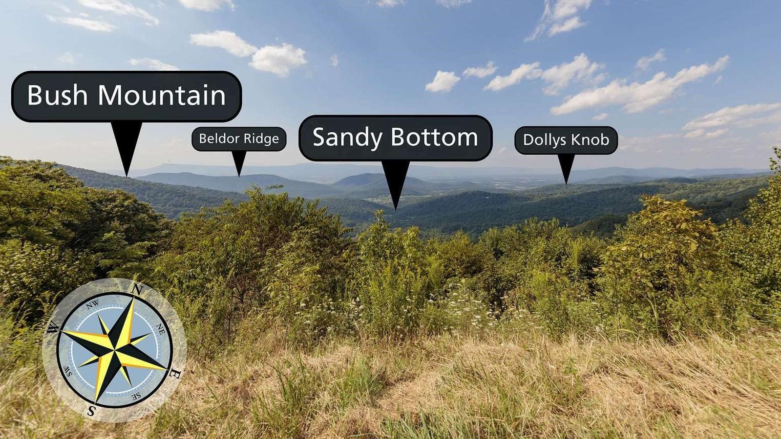 A view over brush down to foothills and valley below.