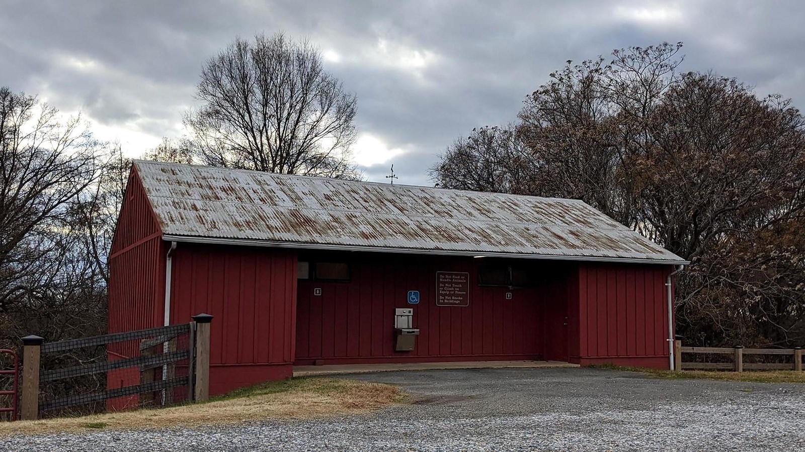 Photo of the public bathroom, just off of the gravel road. Across from the visitor center.