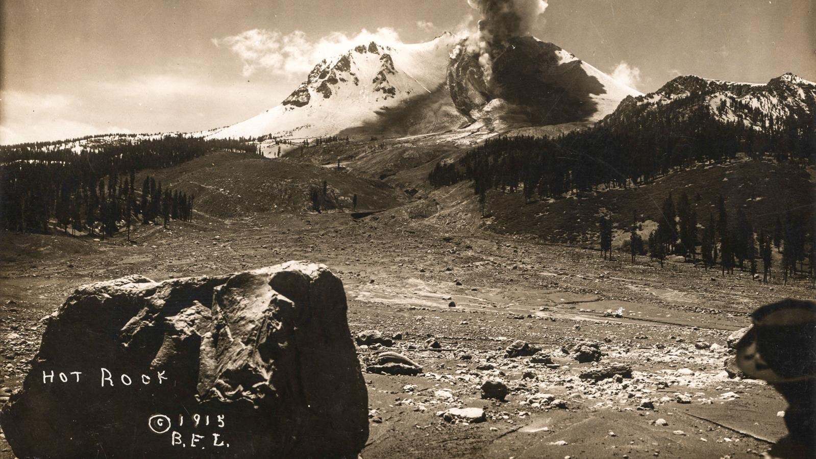 A black and white photo of a large boulder named