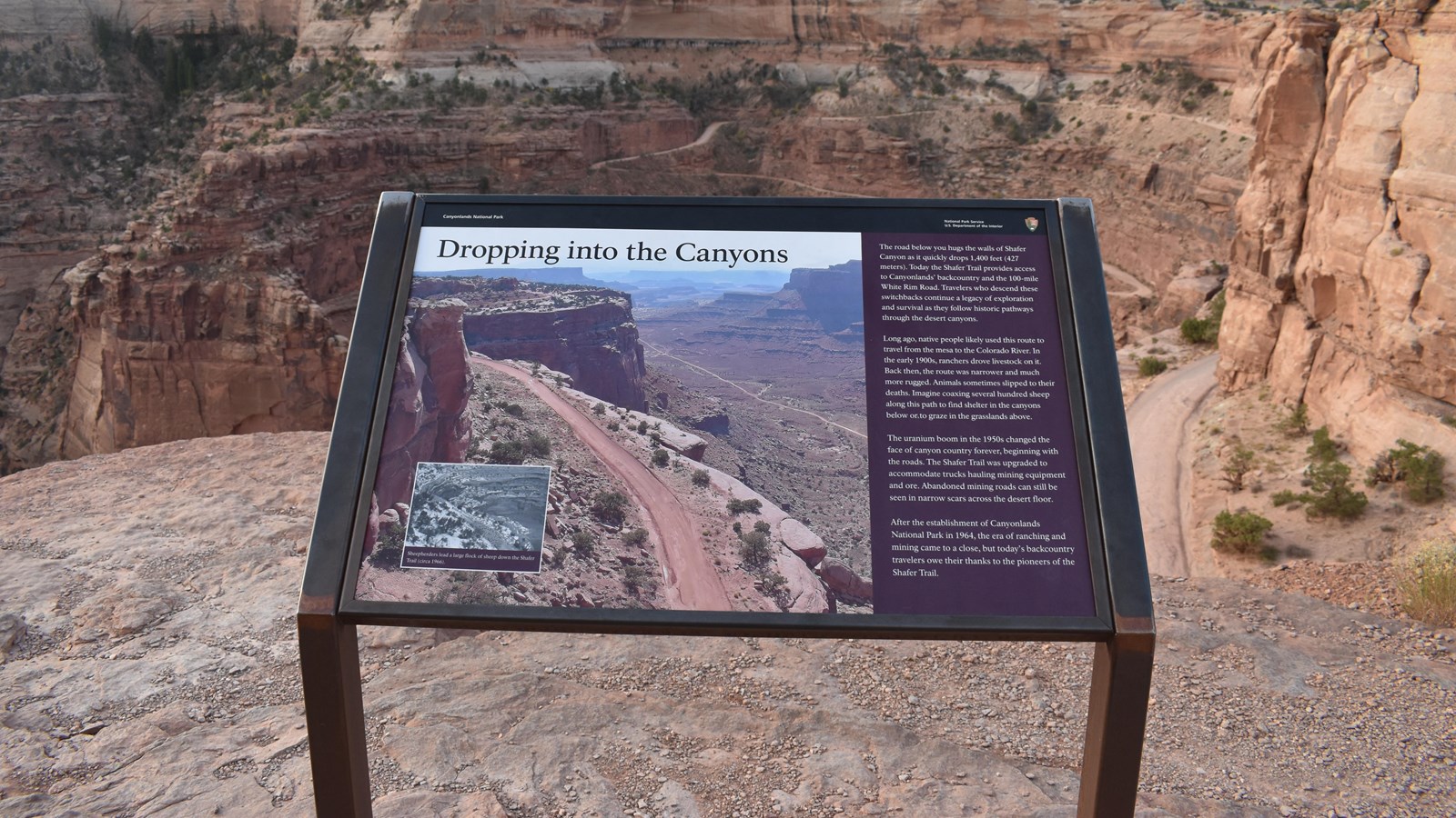 A sign at the shafer canyon overlook provides information on the shafer trail road. 
