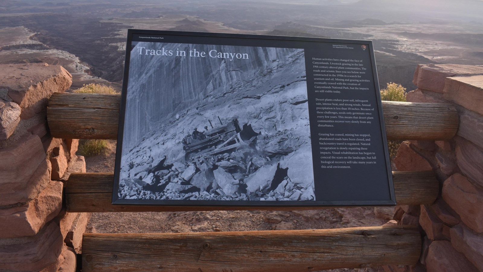 A sign at the Buck Canyon Overlook provides information on human impact on the canyon. 
