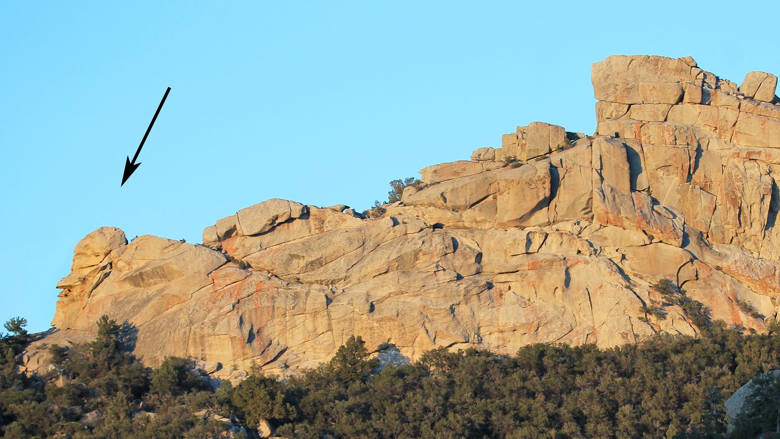 Large granite formation that looks like the profile of a man on the end.