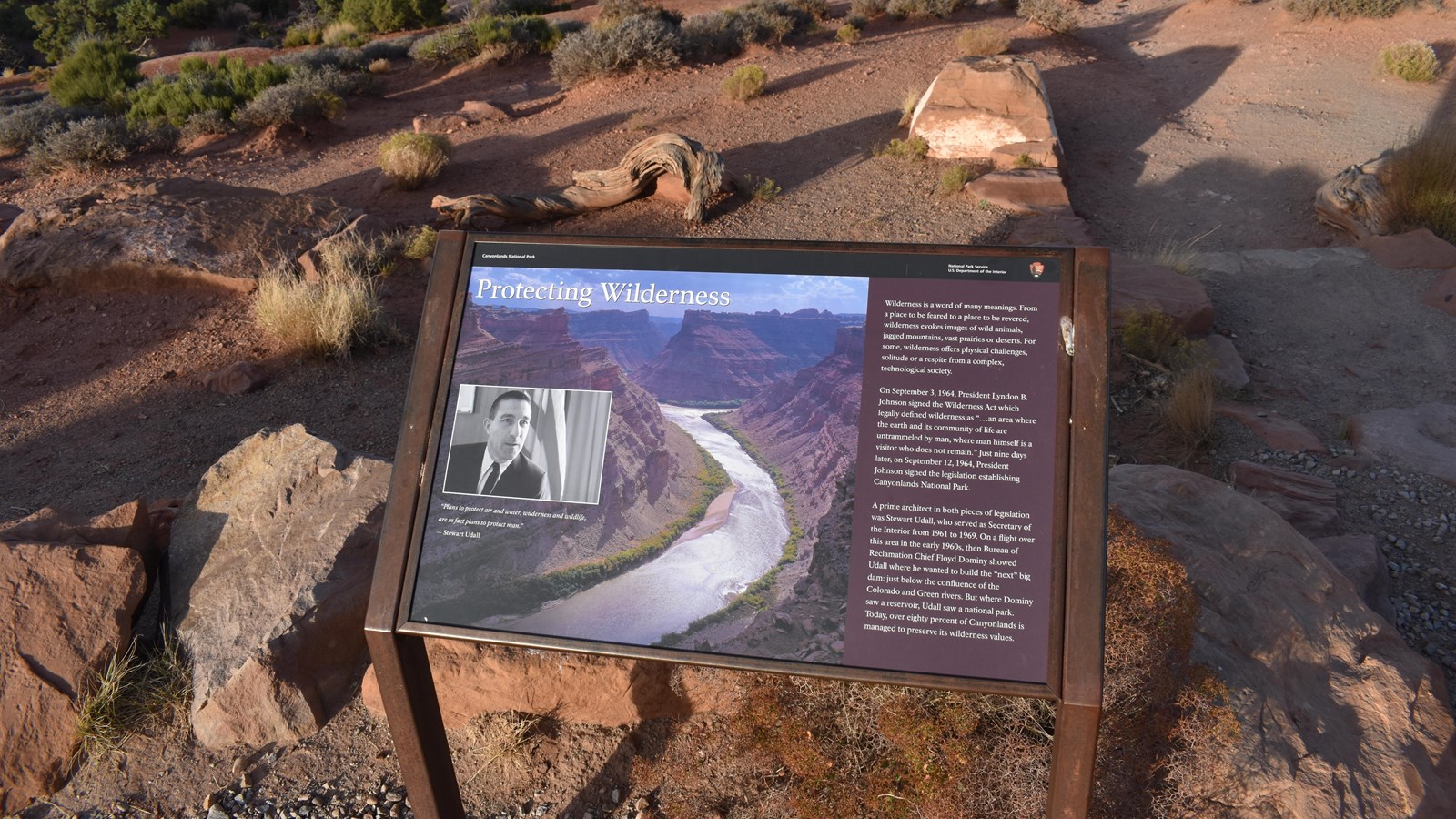 A sign at the Orange Cliffs Overlook provides information on wilderness.