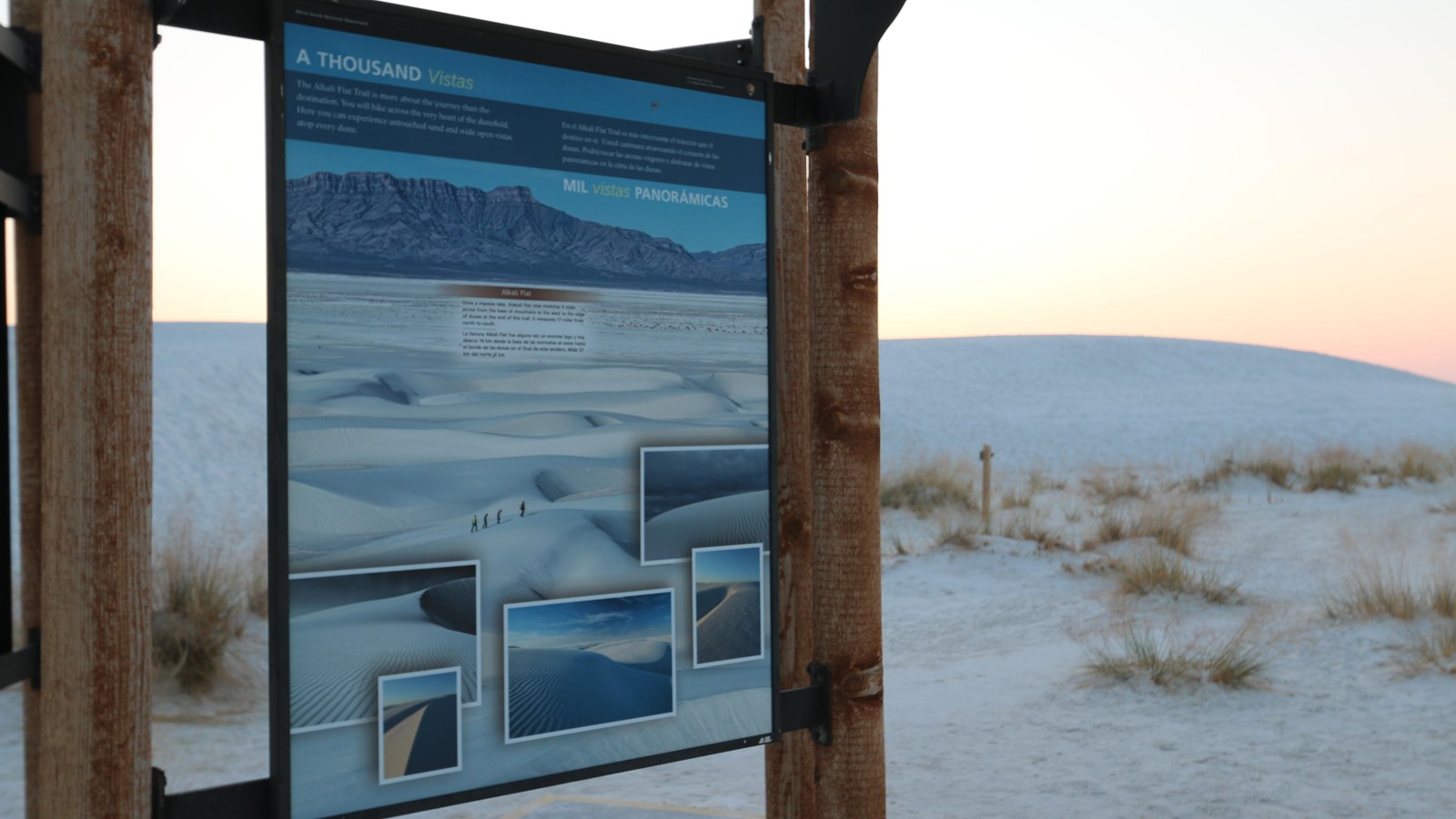 Sign with multiple pictures of white dunes.