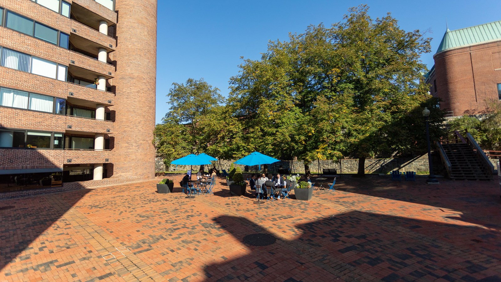 An open stone square in between buildings. 