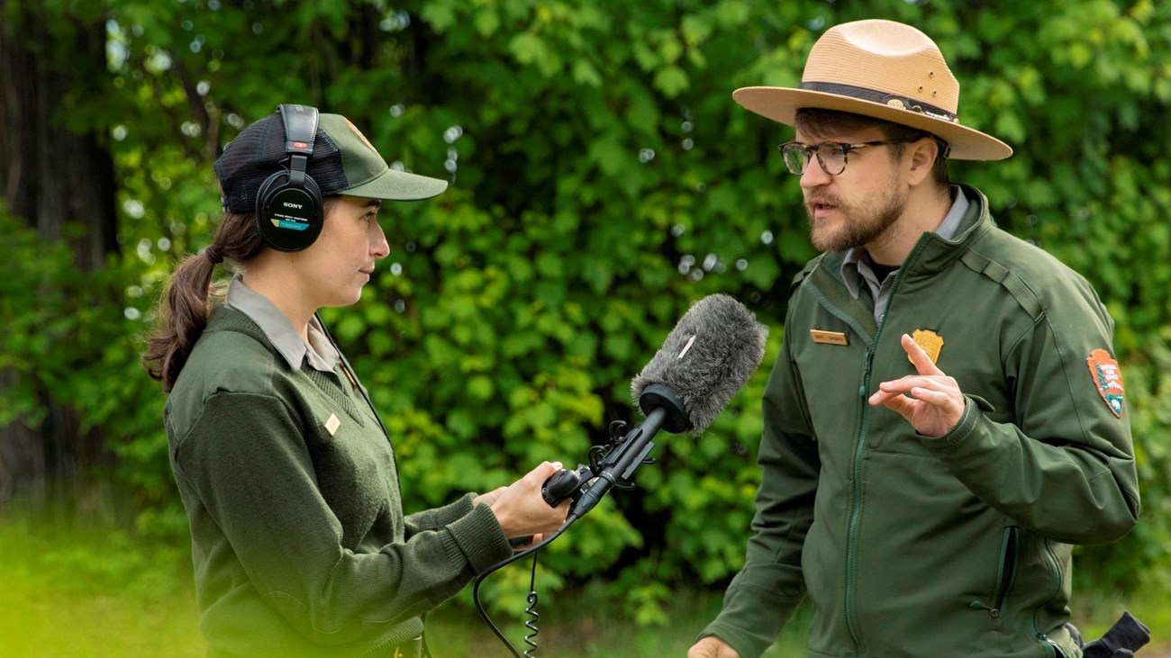 Two rangers talk in uniform