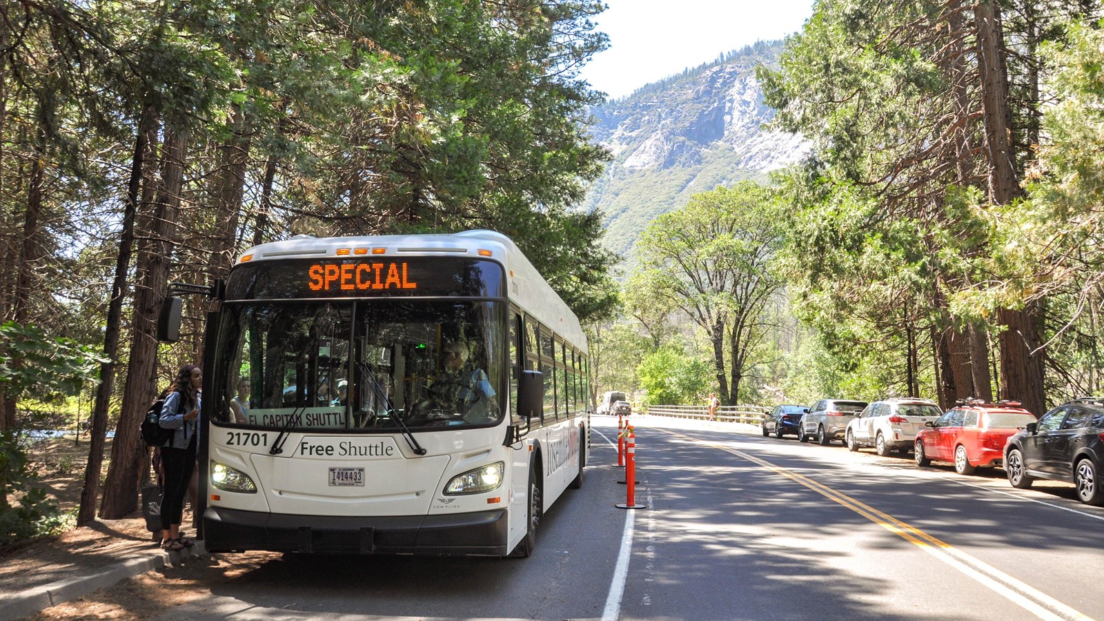Bus pulled over at stop along road