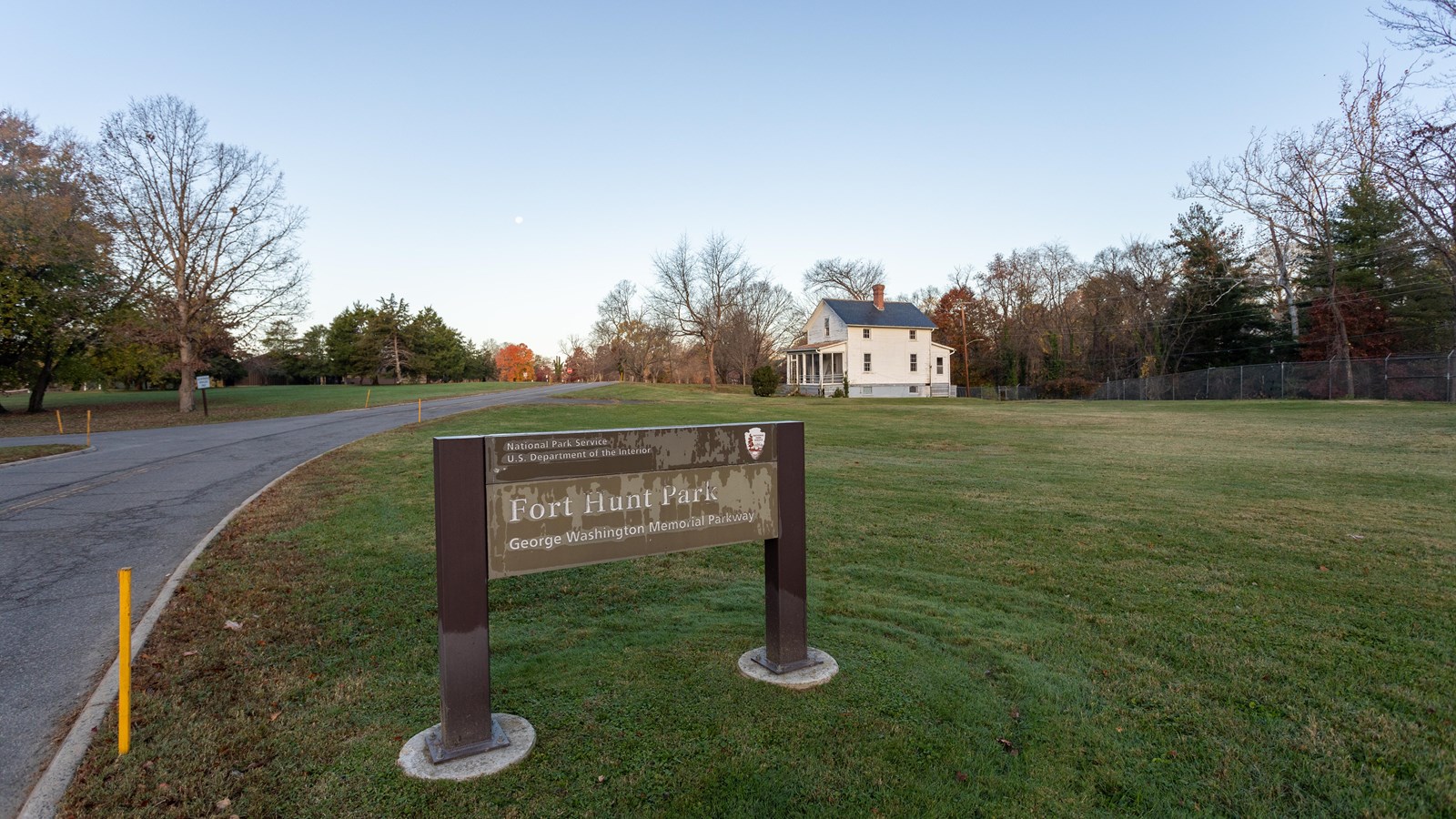 A sign in front of a house.