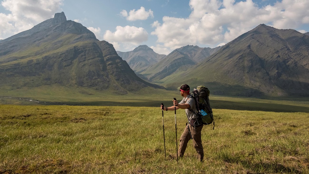 A park ranger backpacking in the mountain wilderness of Gates of the Arctic