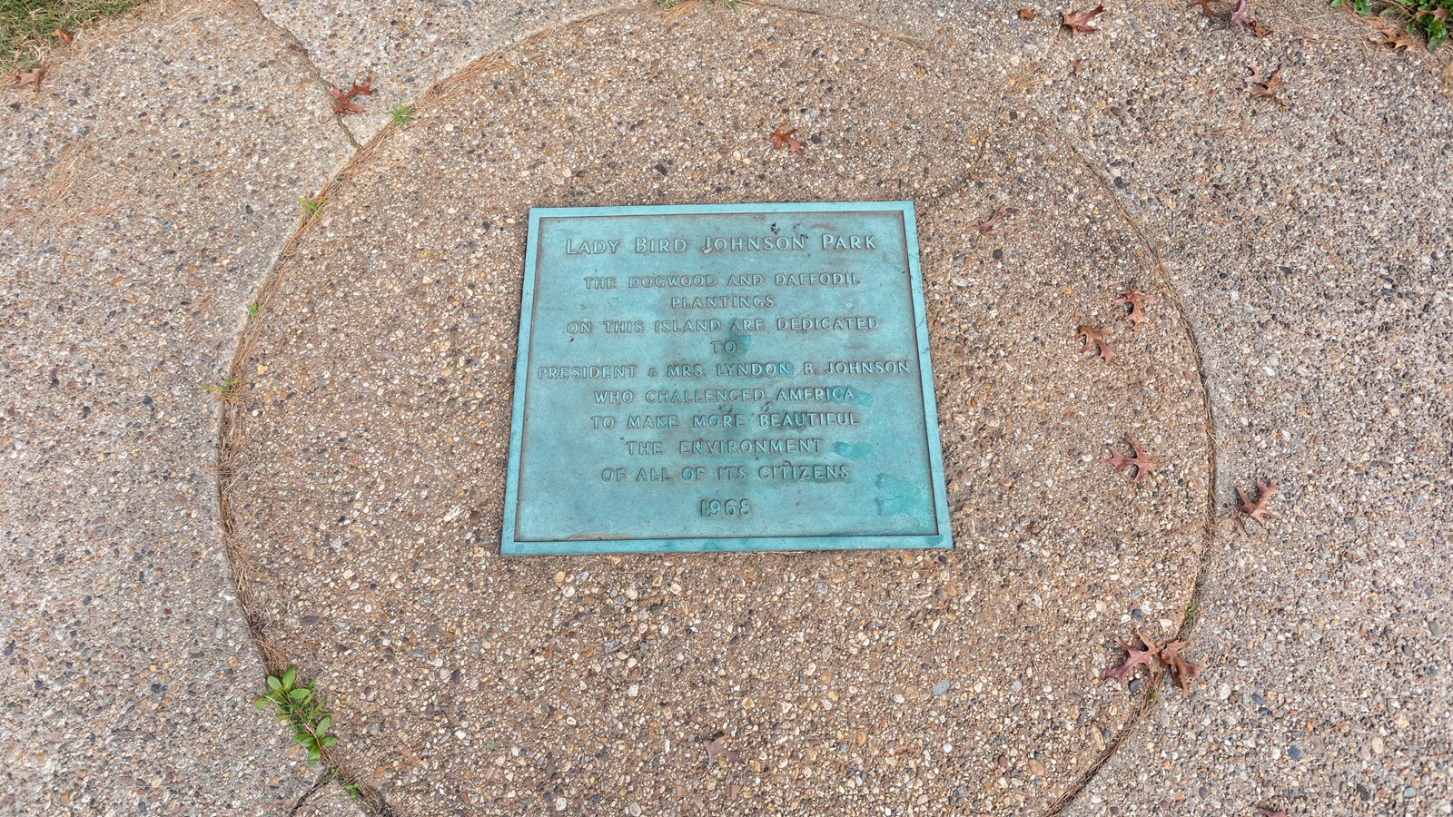 A square green plaque. 