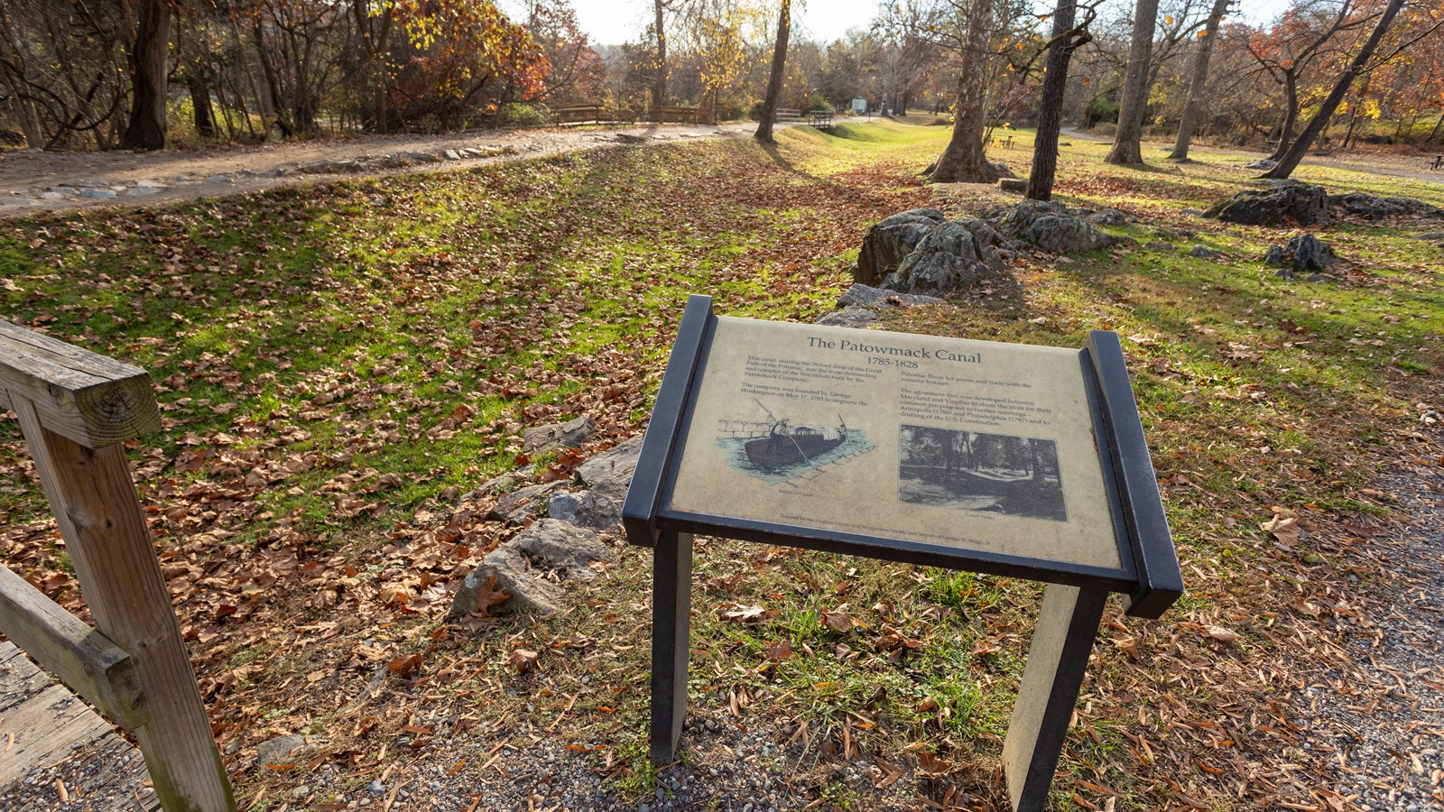 A wayside in front of a trail