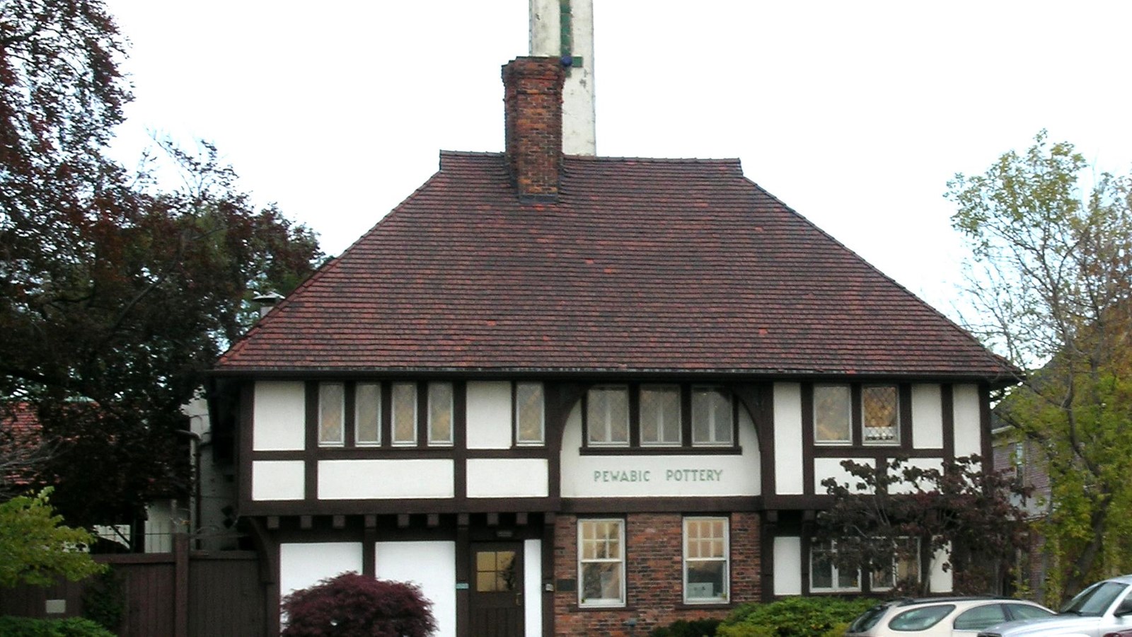 Photo of house with tall chimney. 