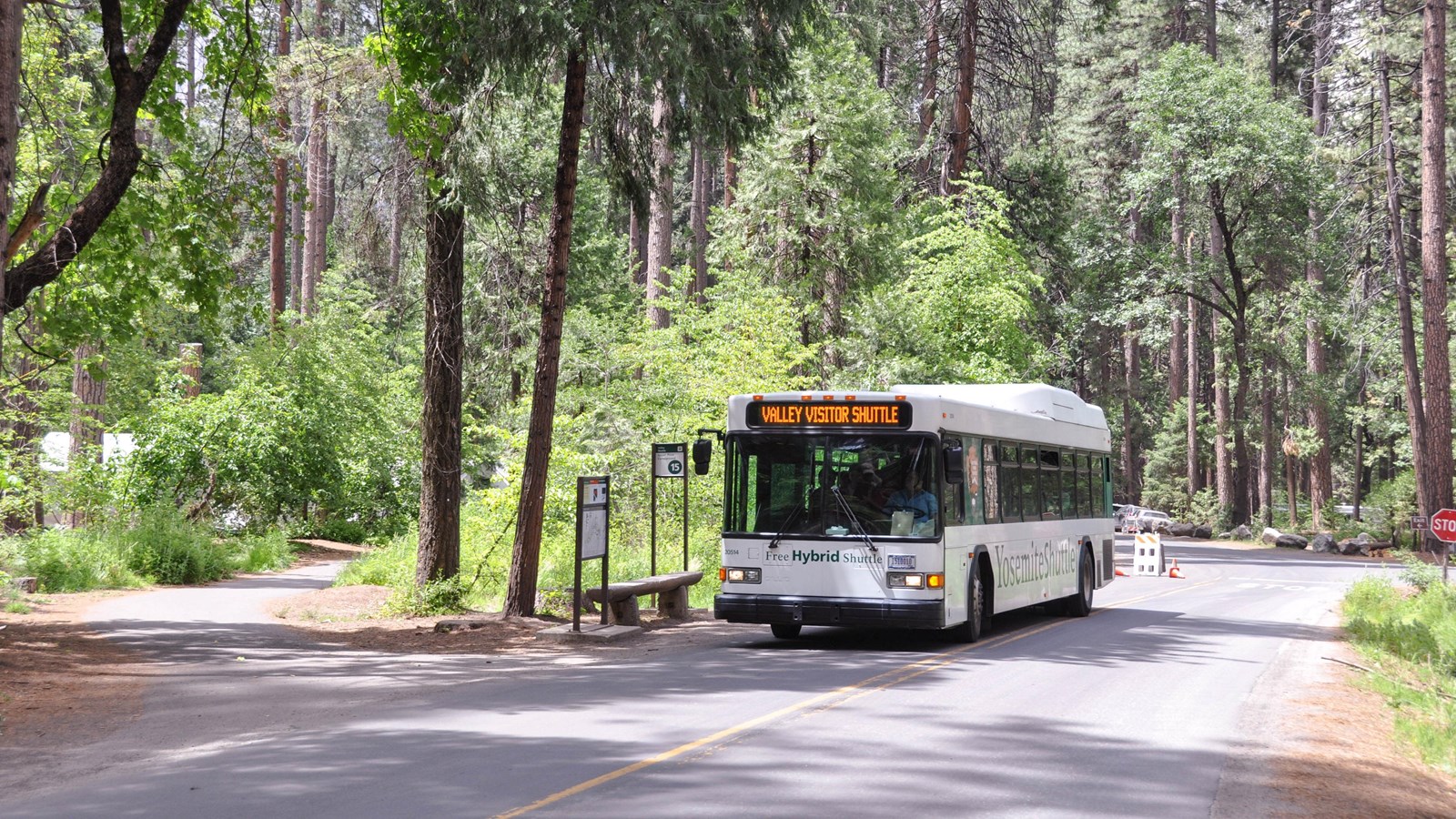 Bus at shuttle stop with benches