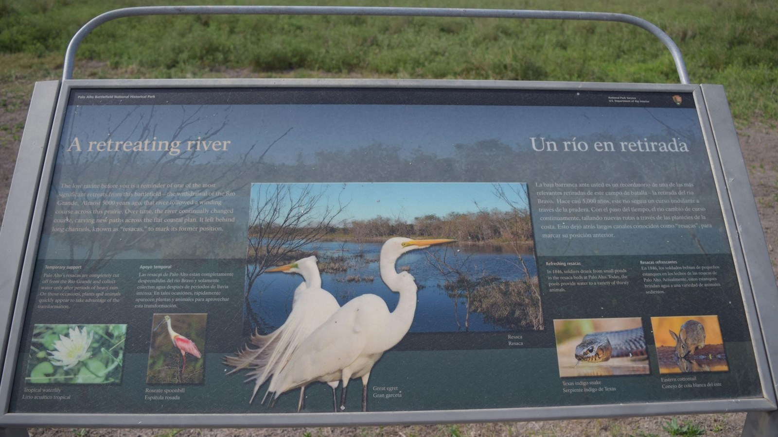 A low-profile wayside base in grey weathering steel for a 36”x 24” interpretation panel.