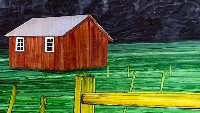A color illustration of a small, wooden shed with a pink sunset sky behind it.