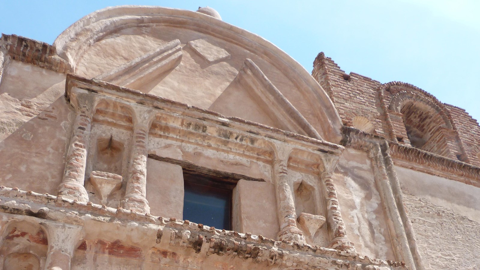 church façade, looking up, columns, window, and arched pediment