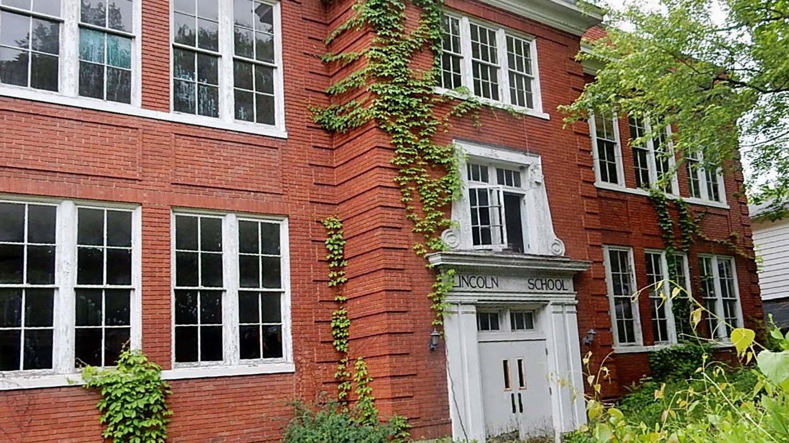 old ivy covered red brich school