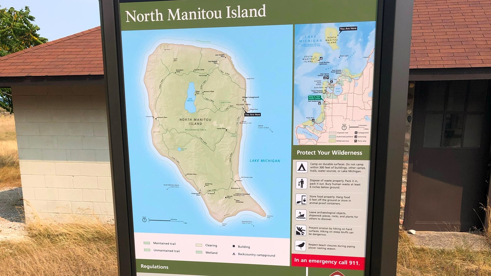 Informational sign showing map of North Manitou Island and rules and regulations