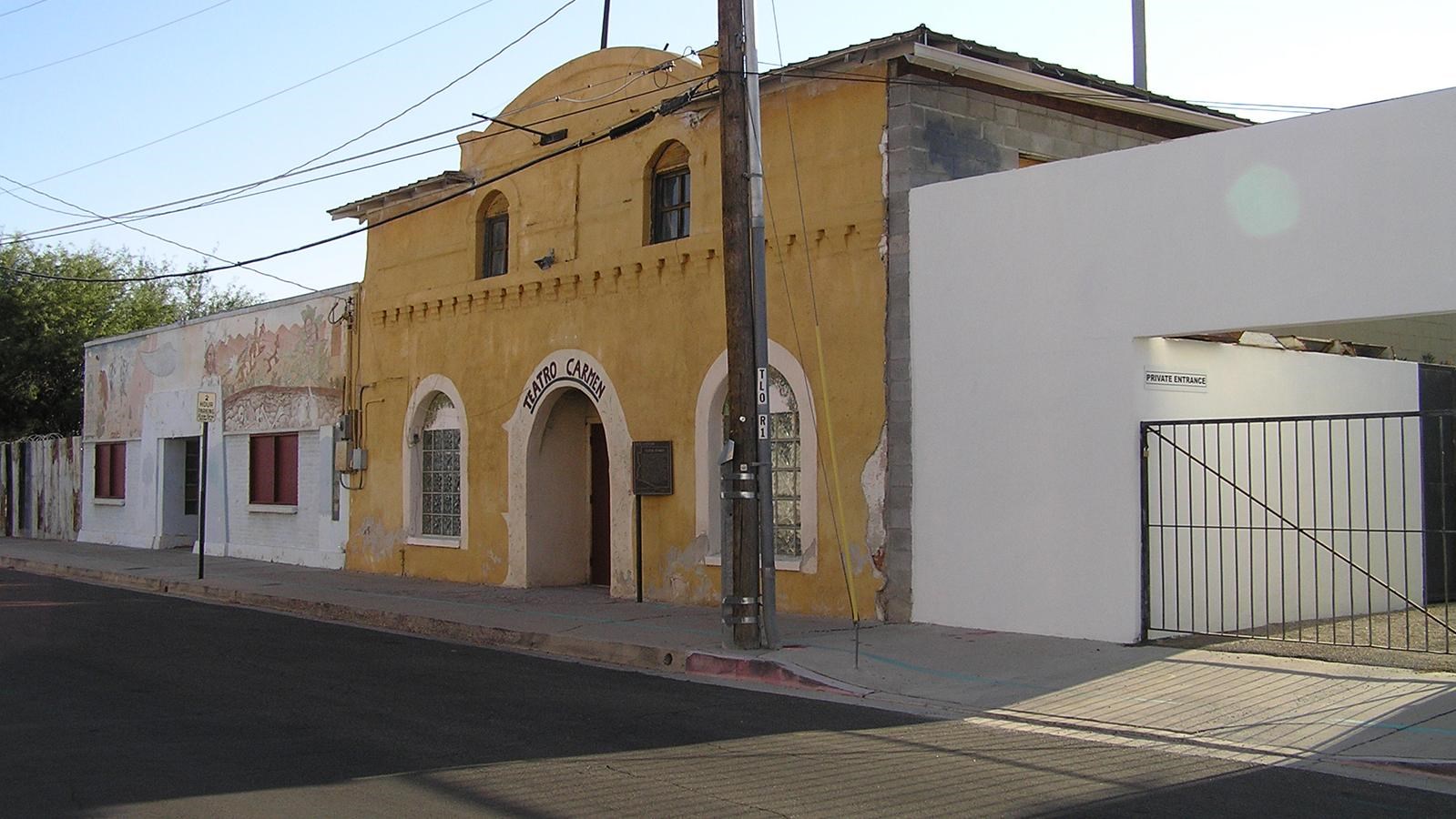 External view of a theater and business in Barrio Libra. By Chris Gillmore CC BY SA