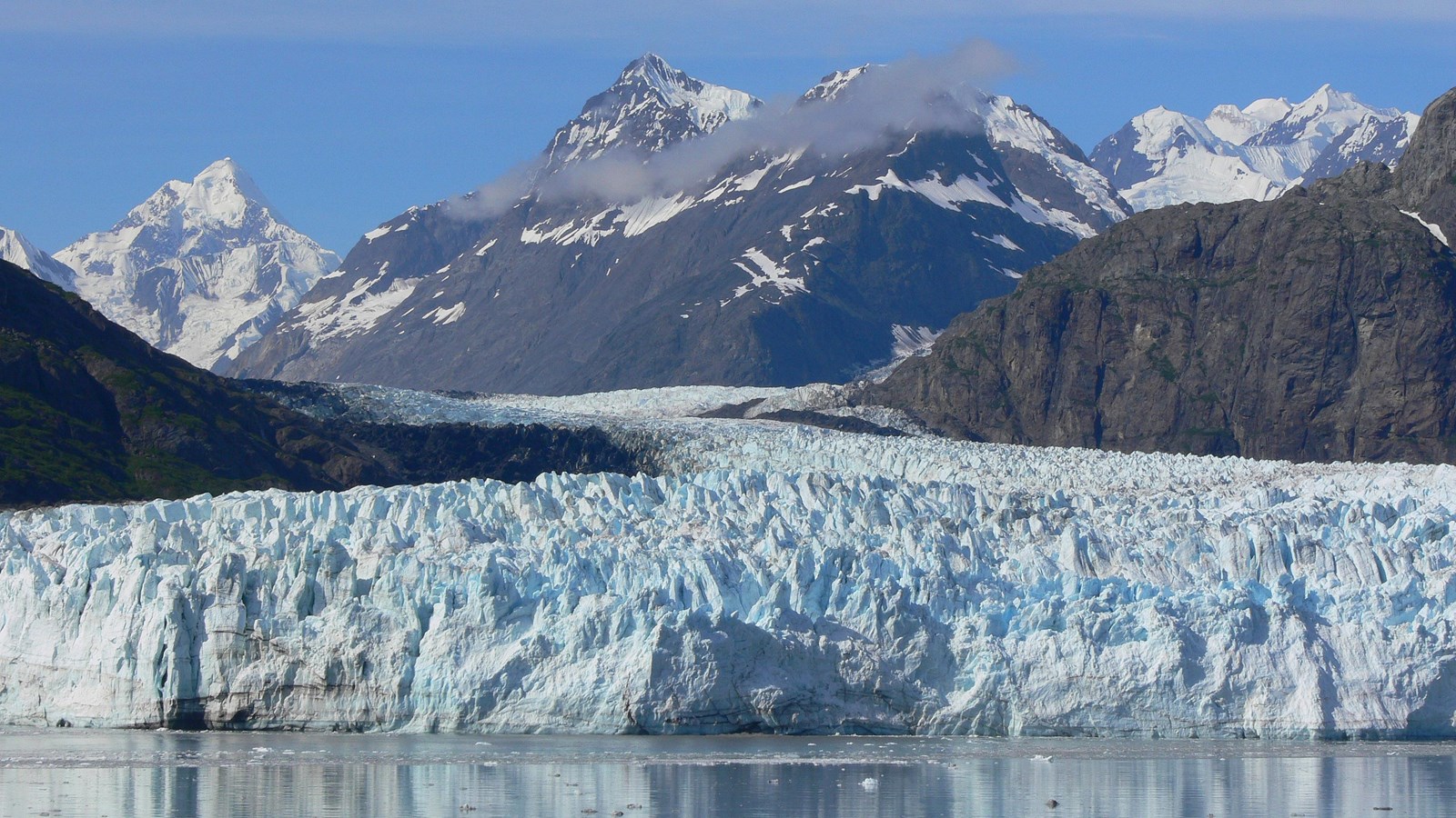 Margerie Glacier can be seen flowing down from the Fairweather Mountains into Glacier Bay.