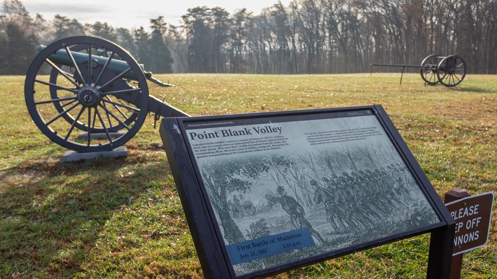 Two howitzers in the background, information panel in foreground