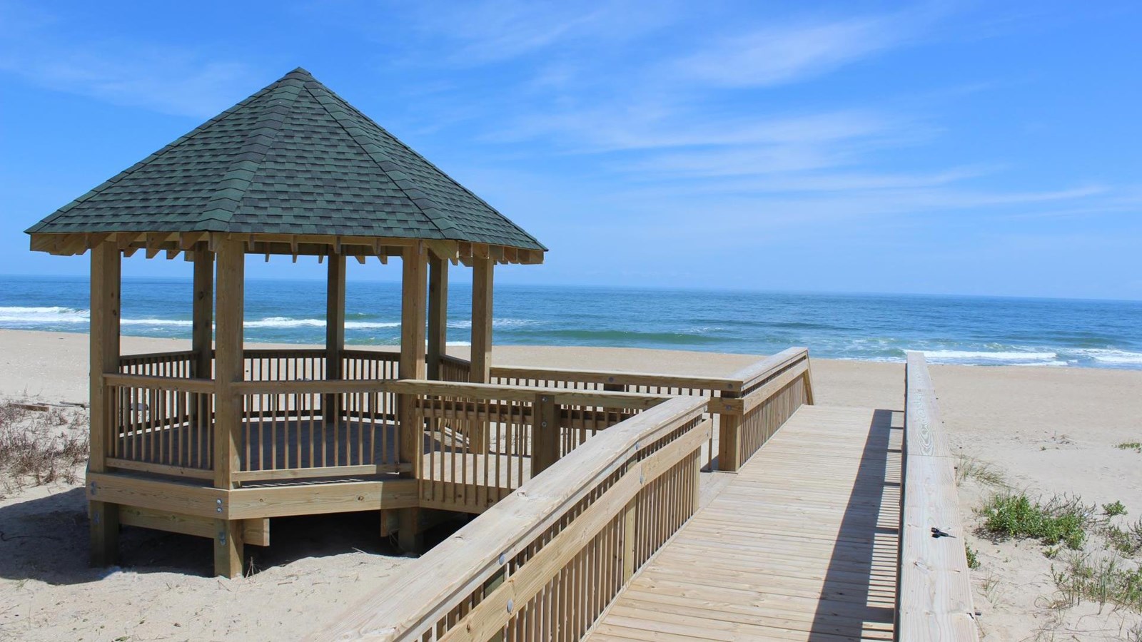 walkway and shade structure on the beach