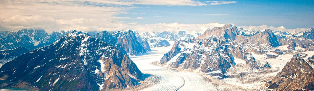 aerial view of mountains and a large glacier