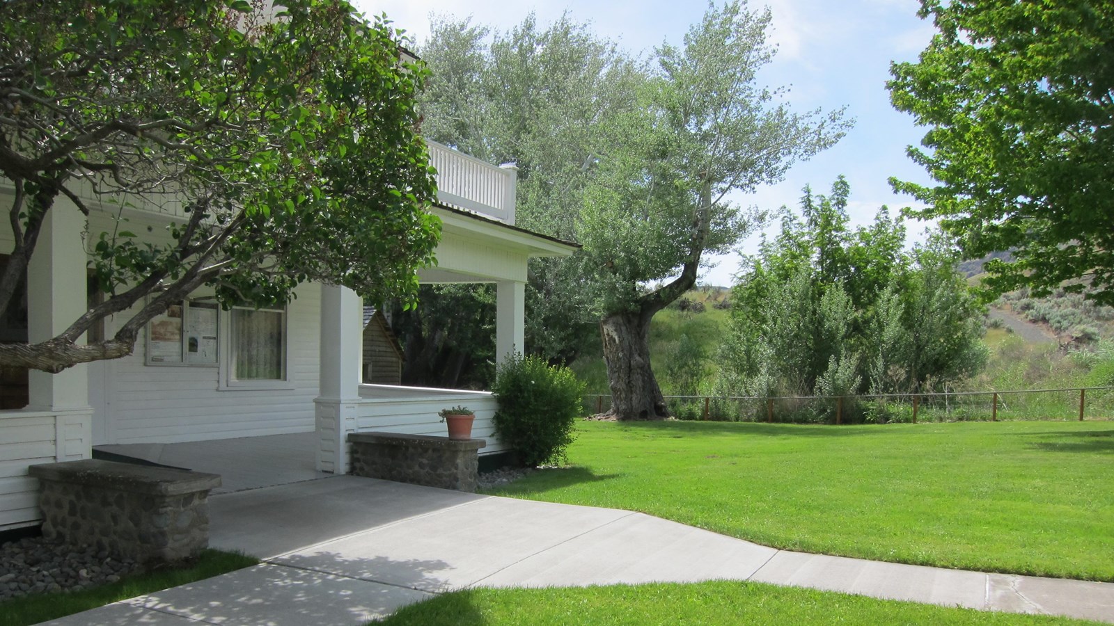 Looking across the yard at the entrance of the Cant Ranch home.