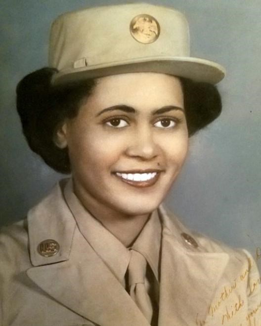 Colorized photo of African American women in her World War Two Uniform. She is smiling at the viewer