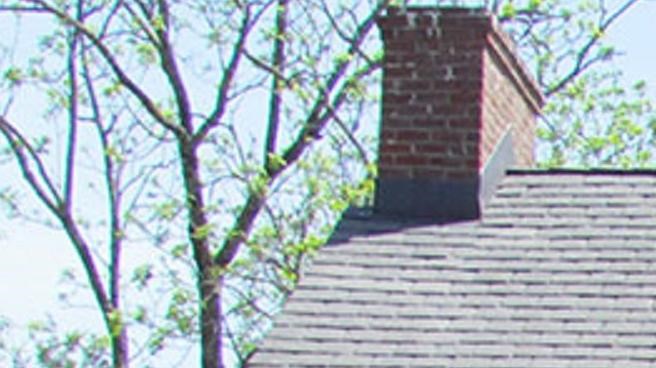 A brick building with yellow trim. 