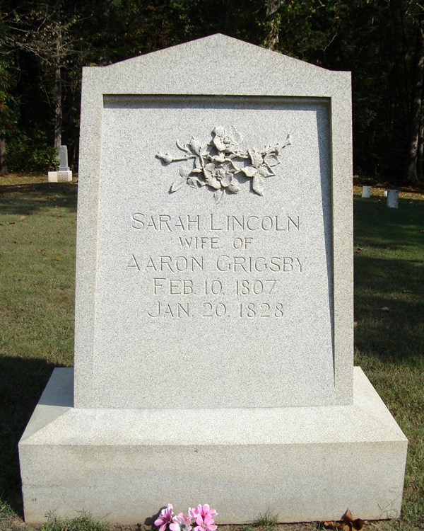 Grey headstone that says Sarah Lincoln wife of Aaron Grigsby Feb 10 1807 Jan 20 1828