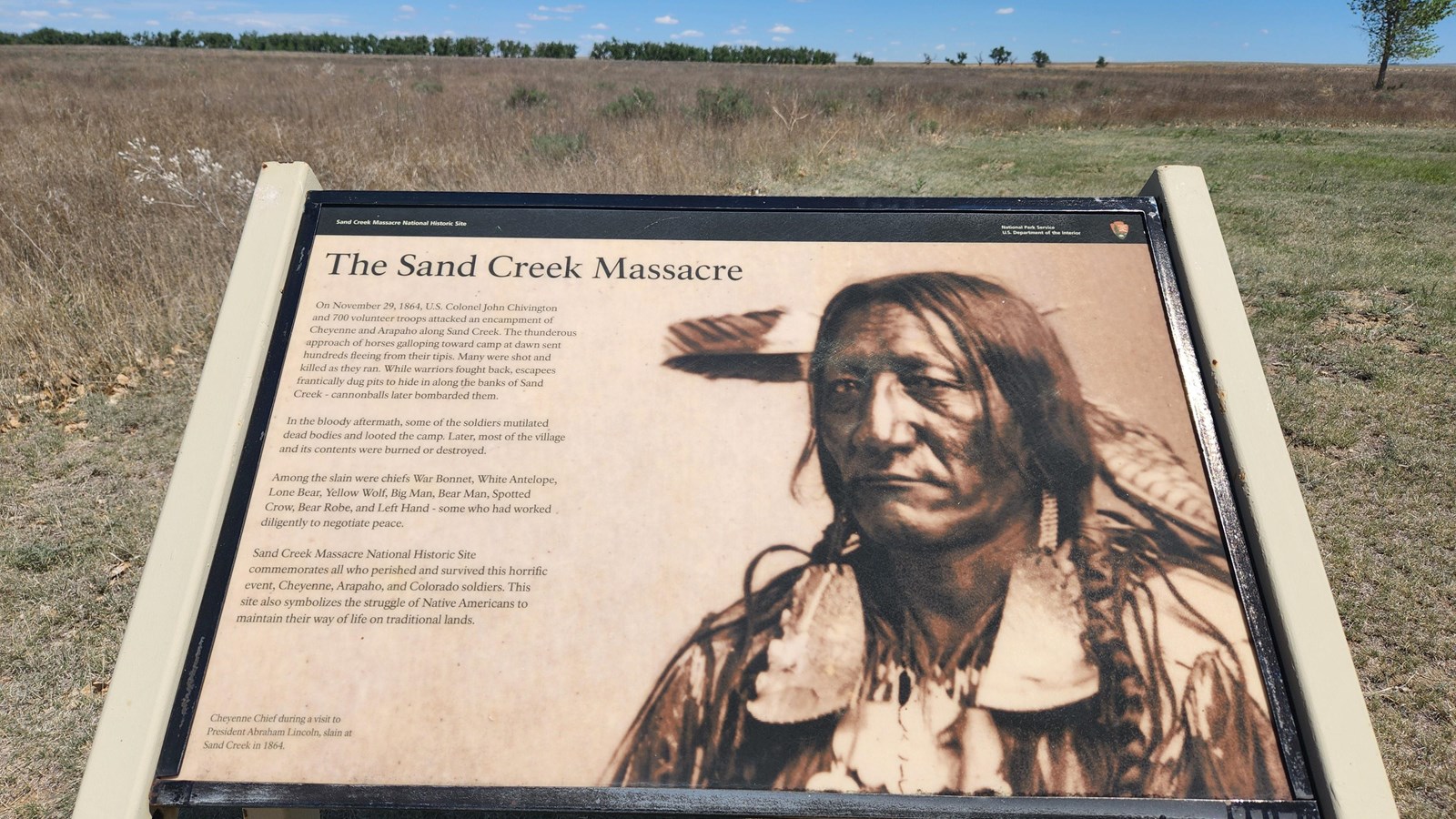A wayside in front of open prairie.